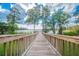 Beautiful walking path leads to a lakefront dock and relaxation at 11726 Belle Haven Dr, New Port Richey, FL 34654