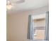 Bedroom featuring blue curtains on the windows and neutral walls at 12027 Yellow Finch Ln, Trinity, FL 34655