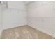 Walk-in closet offering ample storage space with installed shelving at 12027 Yellow Finch Ln, Trinity, FL 34655