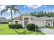 Charming single-story home featuring a well-manicured lawn and lush landscaping at 12027 Yellow Finch Ln, Trinity, FL 34655