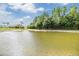 Bask in the scenic beauty of the lake, creating a tranquil and picturesque backyard at 12027 Yellow Finch Ln, Trinity, FL 34655