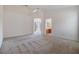 Spacious main bedroom featuring neutral carpet and an ensuite bathroom at 12027 Yellow Finch Ln, Trinity, FL 34655