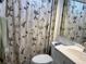 Cozy bathroom with a floral curtain for added privacy at 1243 S Martin Luther King Jr Ave # C505, Clearwater, FL 33756