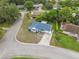 Beautiful aerial view of a corner lot home featuring a long driveway and a well-manicured lawn at 13001 Sawmill Way, Hudson, FL 34667