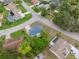 An aerial view showcasing the layout of the property, street and neighborhood homes at 13001 Sawmill Way, Hudson, FL 34667