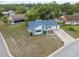 Aerial view of a cozy single-story home with a long driveway and well maintained lawn at 13001 Sawmill Way, Hudson, FL 34667