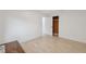 Bedroom featuring hardwood floors, neutral paint, and closet at 13001 Sawmill Way, Hudson, FL 34667