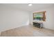 Bedroom featuring hardwood floors, neutral paint, and a large window at 13001 Sawmill Way, Hudson, FL 34667