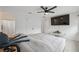 Main bedroom featuring hardwood floors, neutral paint, and TV at 13001 Sawmill Way, Hudson, FL 34667