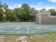 Community playground area with a large play surface and court markings for various games and activities at 13001 Sawmill Way, Hudson, FL 34667