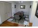 Comfortable dining room boasts hardwood floors and an elegant rug at 13010 Wedgewood Way # A, Hudson, FL 34667