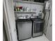 Modern laundry room featuring sleek, stainless steel washer and dryer at 13010 Wedgewood Way # A, Hudson, FL 34667