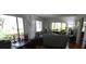 Spacious living room features comfortable seating and a large window with view at 13010 Wedgewood Way # A, Hudson, FL 34667