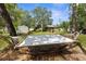 Inviting backyard featuring a comfortable hammock strung between mature trees, creating a relaxing outdoor space at 13444 English Parrot Rd, Brooksville, FL 34614