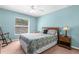 Spacious bedroom with carpet, full bed and a rocking chair at 13444 English Parrot Rd, Brooksville, FL 34614