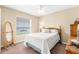 Bedroom featuring a large window, full bed and neutral-toned walls at 13444 English Parrot Rd, Brooksville, FL 34614
