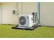 Exterior shot of the homes Carrier HVAC system installed at the rear of the property at 13444 English Parrot Rd, Brooksville, FL 34614