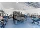 Garage interior with a black ATV and other equipment at 13444 English Parrot Rd, Brooksville, FL 34614