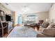 Bright living room showcasing hardwood floors, stylish furniture, and a welcoming atmosphere at 13444 English Parrot Rd, Brooksville, FL 34614