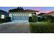 Charming single-story home with a two-car garage and manicured landscaping at 14112 Whitecap Ave, Hudson, FL 34667