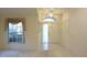 Inviting foyer featuring tile flooring, high ceilings, and natural light at 14112 Whitecap Ave, Hudson, FL 34667