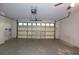 Spacious two-car garage with an automatic door and room for storage at 14112 Whitecap Ave, Hudson, FL 34667