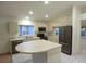 Spacious kitchen featuring a center island, stainless appliances, and ample counter space at 14112 Whitecap Ave, Hudson, FL 34667