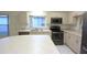 Bright kitchen featuring modern appliances and ample counter space at 14112 Whitecap Ave, Hudson, FL 34667