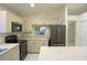 Well-lit kitchen featuring stainless steel appliances and light countertops at 14112 Whitecap Ave, Hudson, FL 34667