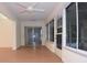 Bright sunroom with laminate floors and multiple windows at 14112 Whitecap Ave, Hudson, FL 34667