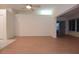 Spacious living room with wood flooring and views of outdoor spaces at 14112 Whitecap Ave, Hudson, FL 34667
