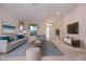 Bright living room with a comfortable sitting area and a view of the entry at 14112 Whitecap Ave, Hudson, FL 34667