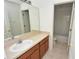 Bathroom featuring a vanity with sink, mirror, and a view into the toilet and bath area at 15160 Durango Cir, Brooksville, FL 34604