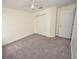 Bedroom features neutral walls, carpet flooring, and a closet offering storage space at 15160 Durango Cir, Brooksville, FL 34604