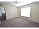 Comfortable bedroom with neutral walls, carpet, closet and plenty of natural light from the window at 15160 Durango Cir, Brooksville, FL 34604