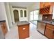Bright kitchen features tile floors, stainless steel appliances, and a convenient center island at 15160 Durango Cir, Brooksville, FL 34604