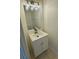 Small powder room featuring a vanity with mirror, vanity lighting, and a tiled floor at 15160 Durango Cir, Brooksville, FL 34604