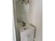 Small powder room featuring a vanity with mirror and a tiled floor at 15160 Durango Cir, Brooksville, FL 34604