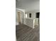 Upstairs hallway showcases wood floors, neutral walls and is illuminated with natural light at 15160 Durango Cir, Brooksville, FL 34604