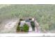 Aerial view of a single Gathering home in a private setting with a pool and detached shed, property lines shown at 15287 Coot Rd, Weeki Wachee, FL 34614