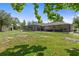 Expansive backyard featuring a screened pool, covered patio, storage shed, and ample green space for outdoor enjoyment at 15287 Coot Rd, Weeki Wachee, FL 34614