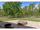 This backyard has a firepit and a forest view that creates a private, peaceful ambiance at 15287 Coot Rd, Weeki Wachee, FL 34614