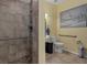 Accessible bathroom with tile shower and grab bars at 15287 Coot Rd, Weeki Wachee, FL 34614