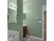 Bathroom with a vanity, and view of a soaking tub, wall mirror, and doorway to an adjacent room at 15287 Coot Rd, Weeki Wachee, FL 34614
