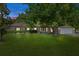 Charming single-story home with well-manicured lawn and mature shade trees at 15287 Coot Rd, Weeki Wachee, FL 34614
