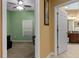 Hallway view featuring a bedroom and a bathroom with neutral colors and stylish decor at 15287 Coot Rd, Weeki Wachee, FL 34614