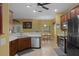 Bright kitchen with stainless steel appliances, wood cabinets, and an eat-in dining area at 15287 Coot Rd, Weeki Wachee, FL 34614