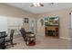 Cozy living room area offers seating, natural light, and a fireplace, creating a comfortable and inviting space for relaxation at 15287 Coot Rd, Weeki Wachee, FL 34614