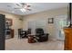 Cozy living room features tile floors, dining table, natural light, and a comfortable recliner, perfect for relaxation at 15287 Coot Rd, Weeki Wachee, FL 34614