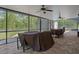 This covered pool and patio area includes a table and chairs, as well as a shed at 15287 Coot Rd, Weeki Wachee, FL 34614